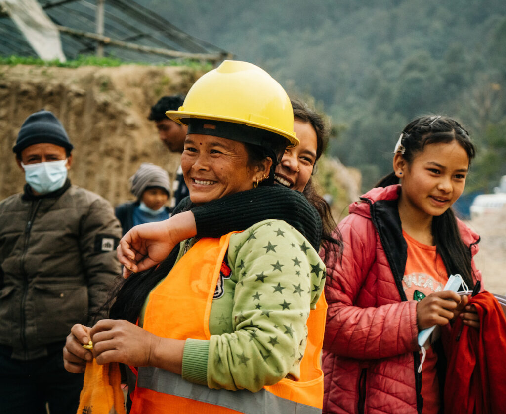 women smiling and hugging