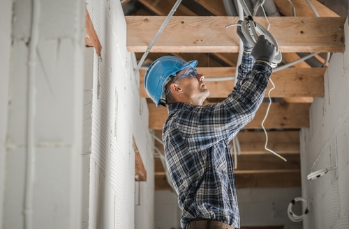 An electrician updates the wiring in a Colorado home.