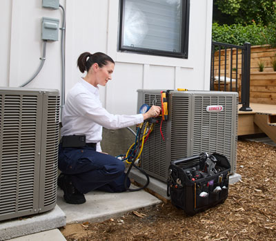 technician workin on ac unit